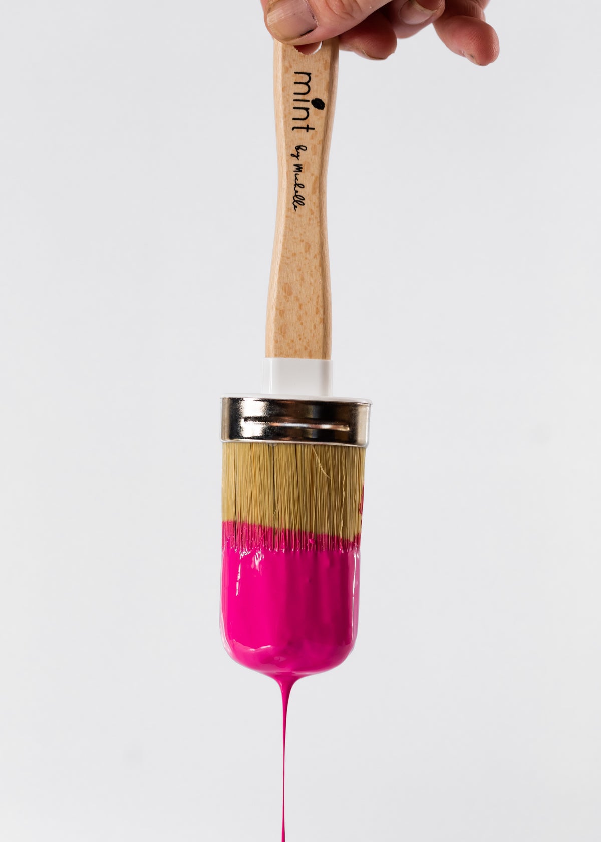 Premium Photo  New and used paintbrushes in a vase on a pink